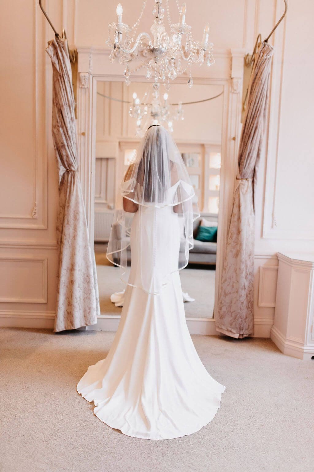 The Hattie is a 2 Tier Veil in classic tulle, decorated all the way around with a 10mm flat ribbon. Click to shop now.