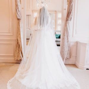 This 2 Tier veil in classic tulle is decorated all the way around both Tiers with Sophie Lace. Click to shop now.