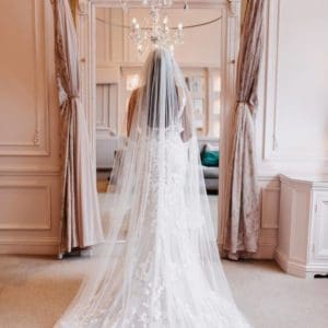This gorgeous single tier veil in classic tulle has a scatter of Swarovski crystals all over for extra glam. Click to shop Vivi.