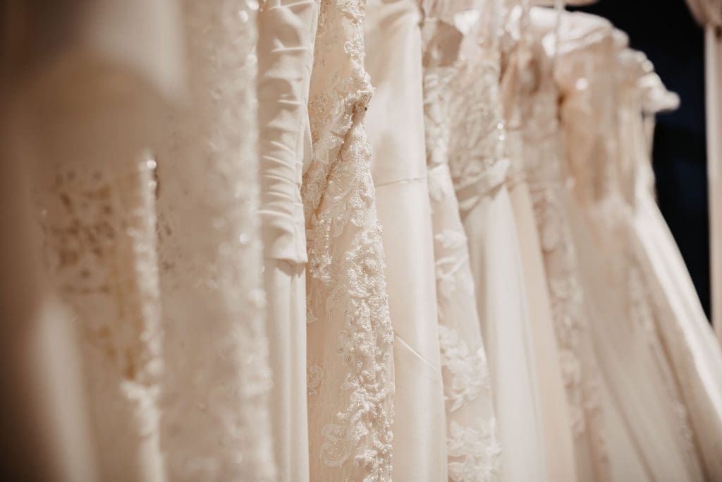 A close up of the different textures of dresses at The Harrogate Wedding Lounge. Lace, Chiffon, Appliqué, Beading and Tulle can all be seen