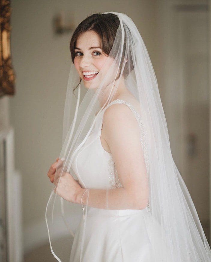 Olivia chose Camryn by Justin Alexander for her wedding dress